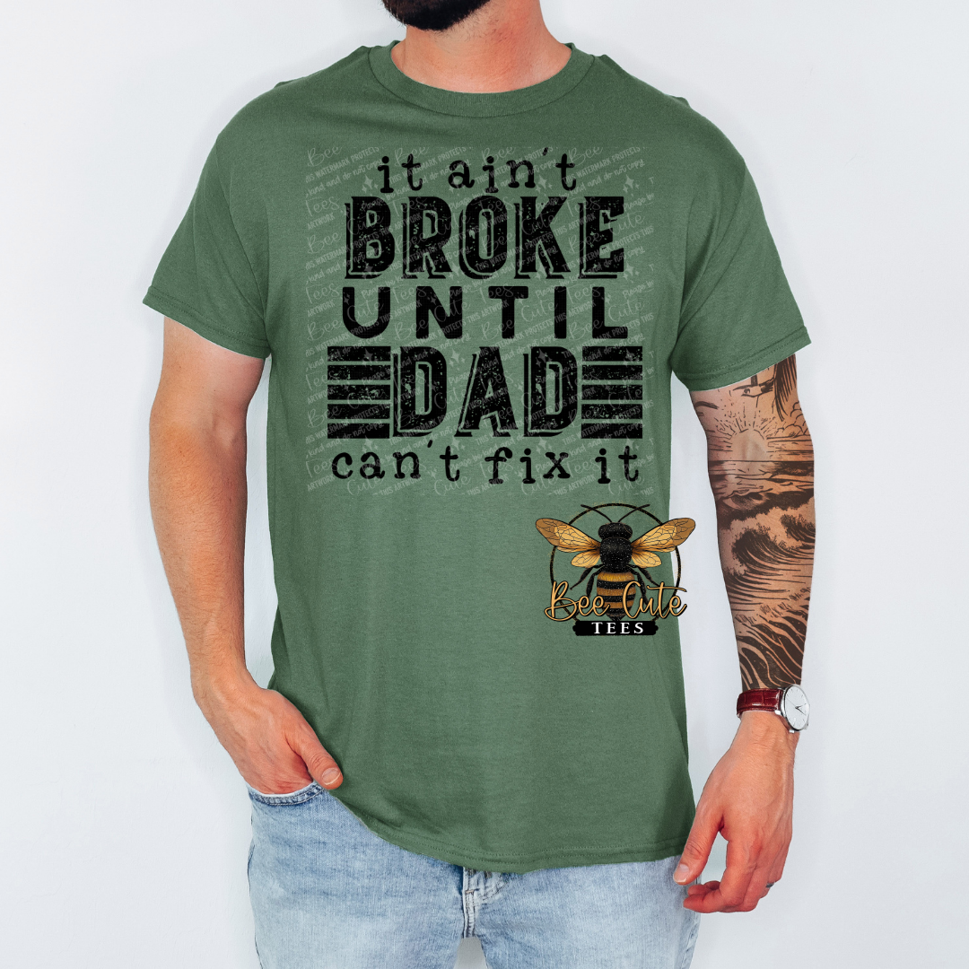 Person wearing a green t-shirt with text and a logo on a white background