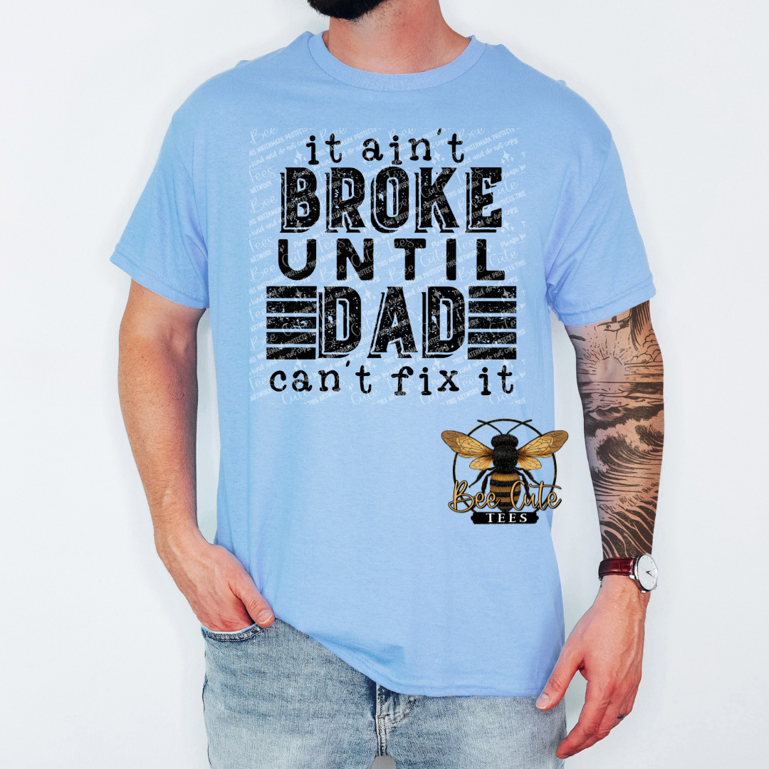 Light blue t-shirt with text and bee logo worn by a person on a white background