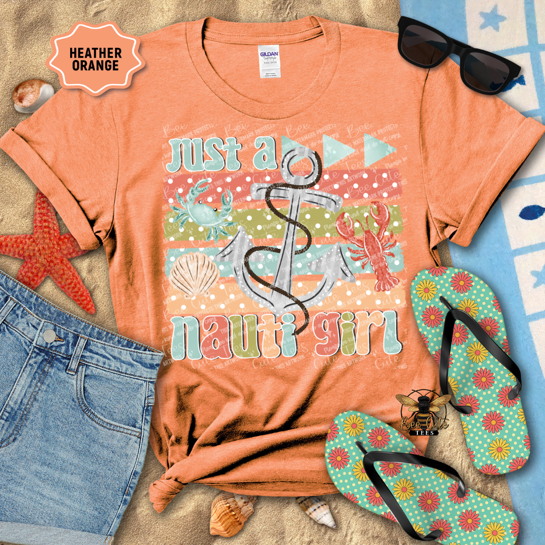 Orange t-shirt with 'Just a nauti girl' design, sunglasses, starfish, and flip-flops on a beach-themed background.