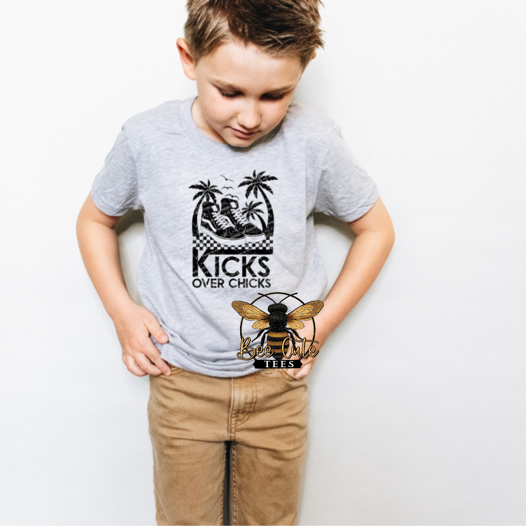 Child wearing a gray t-shirt with a graphic design on a white background