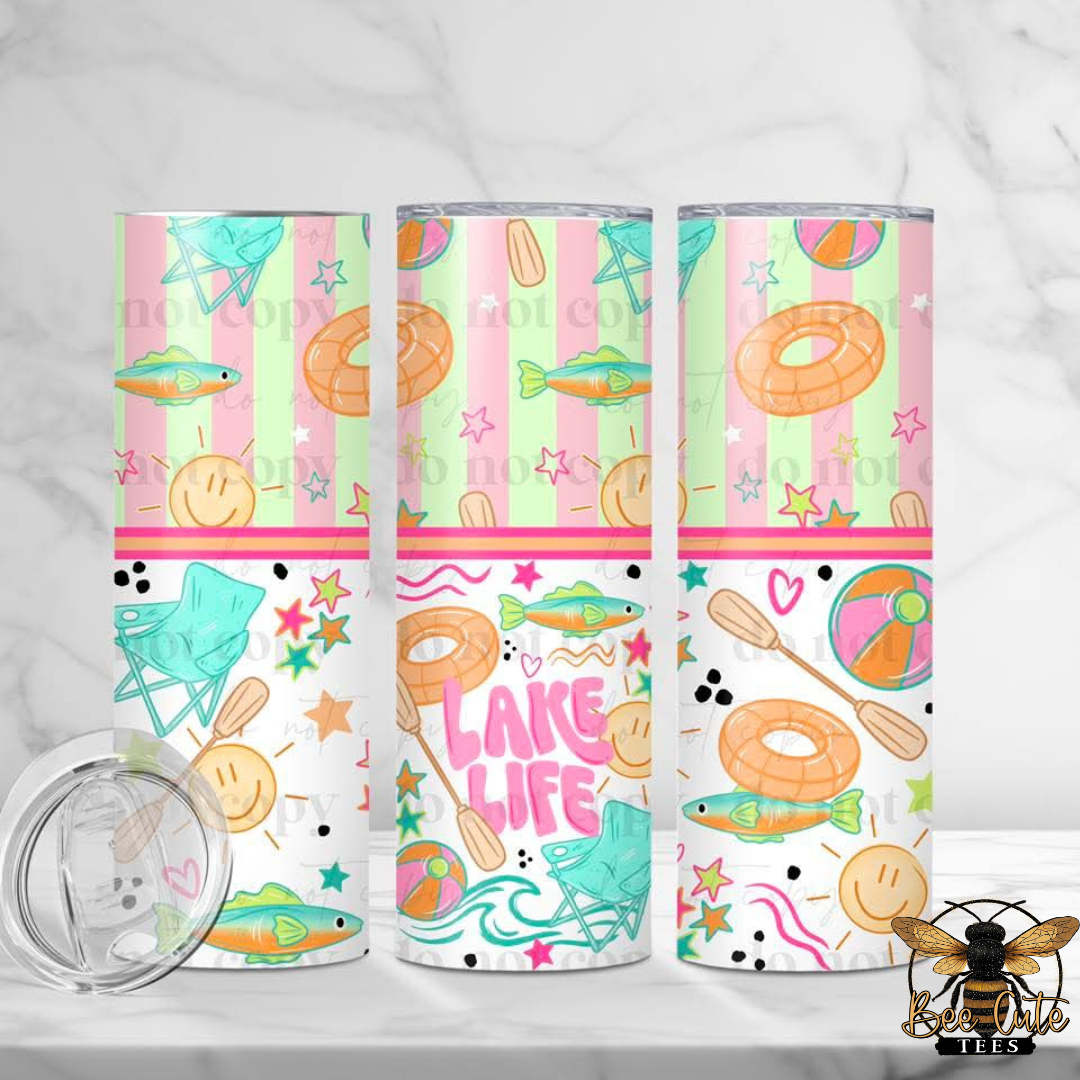 Three colorful tumblers with lake-themed designs on a white background