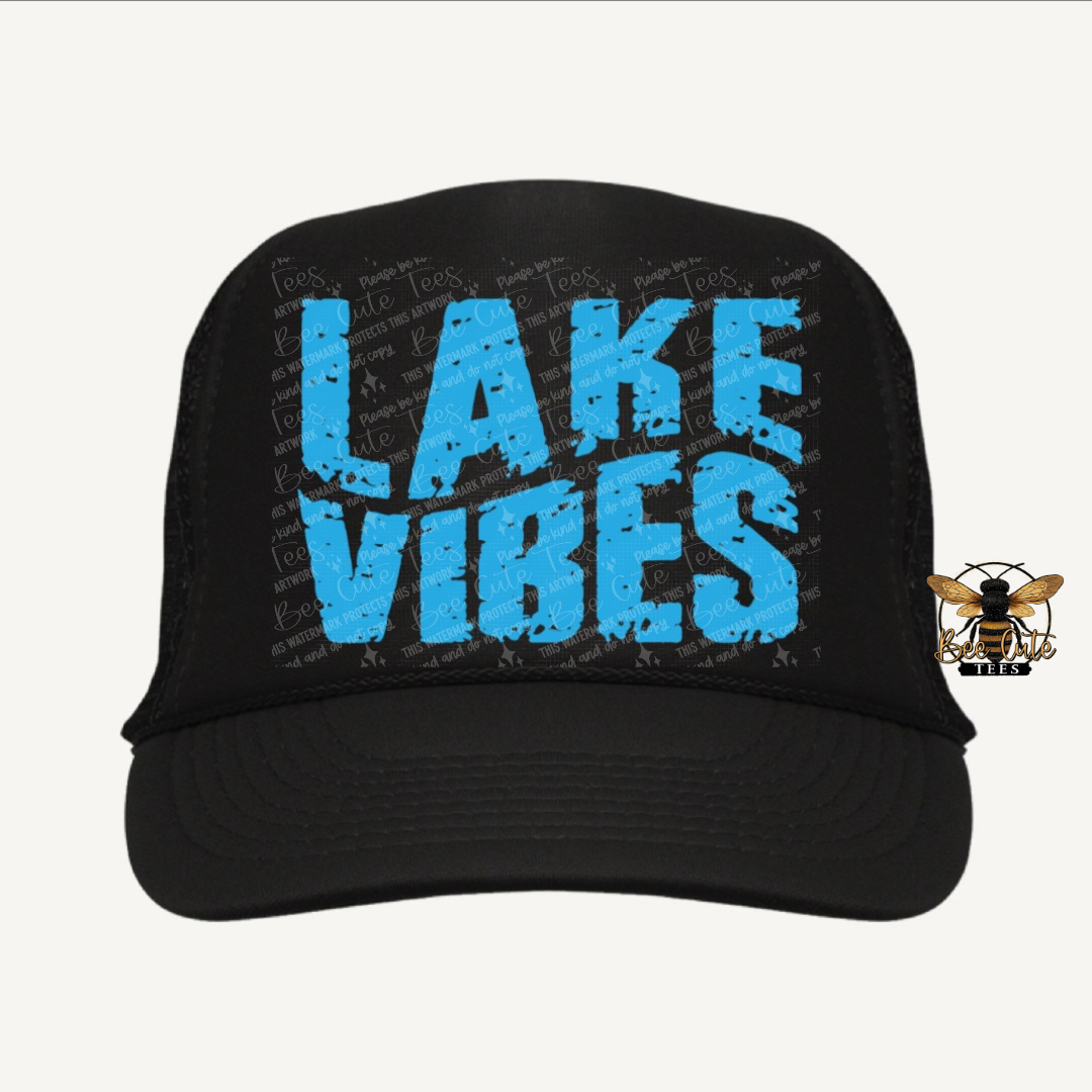 Black cap with 'Lake Vibes' in blue text on a white background
