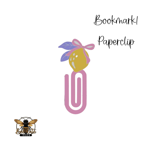 Decorative paperclip with a lemon and flower design on a white background, featuring a brand logo.