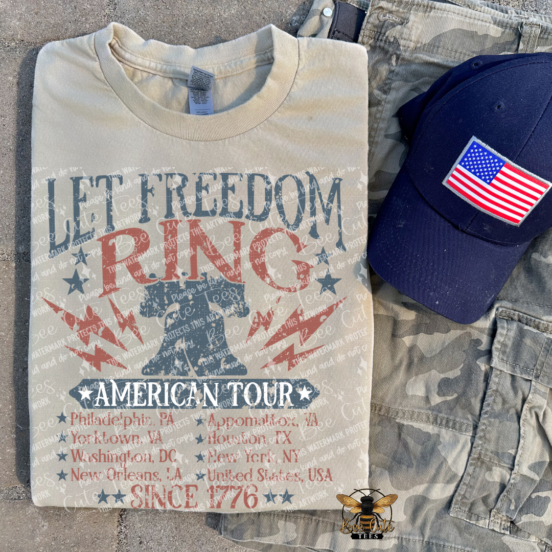 T-shirt with 'Let Freedom Ring' design and American flag cap on camouflage pants