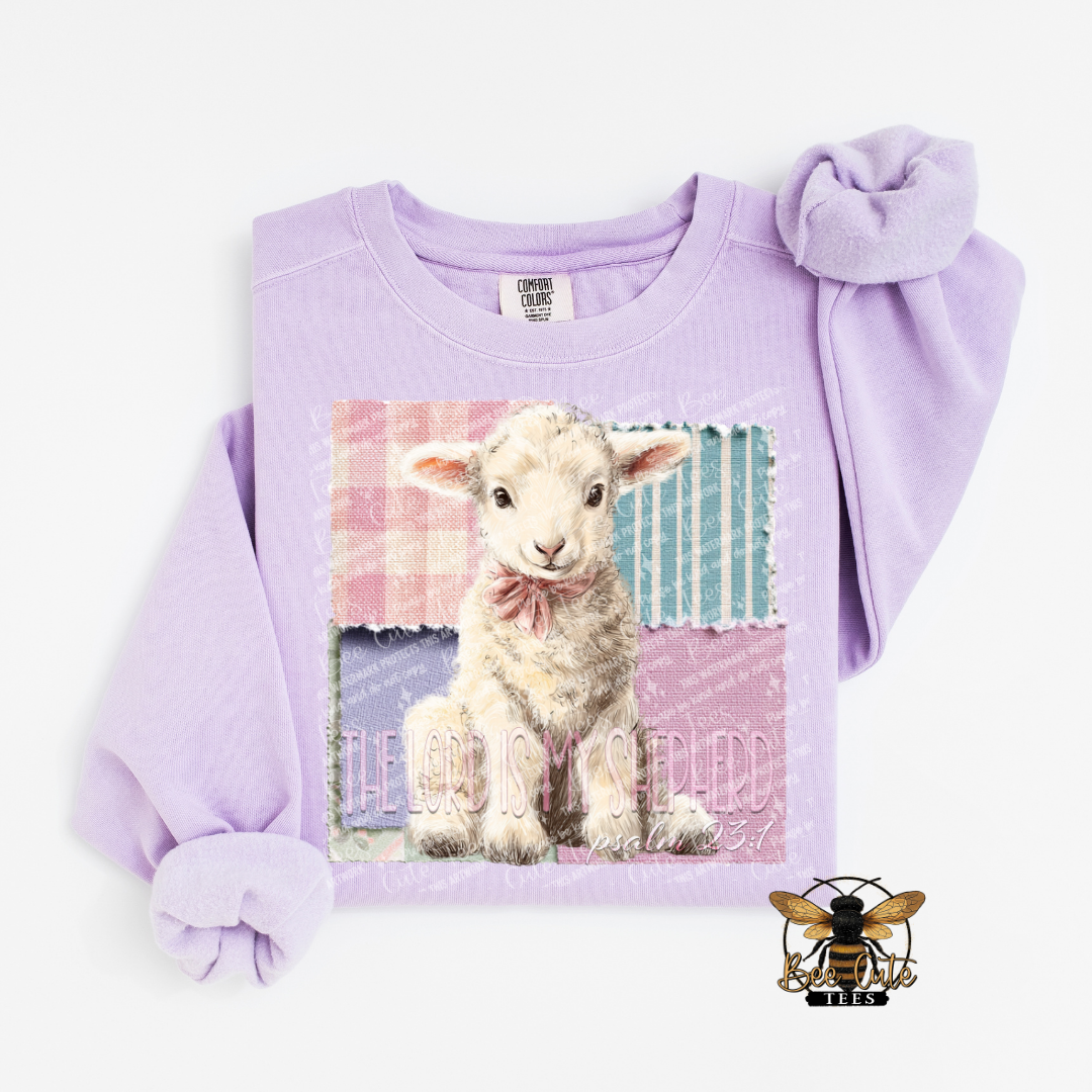 Lavender sweatshirt with a lamb graphic and text on a white background