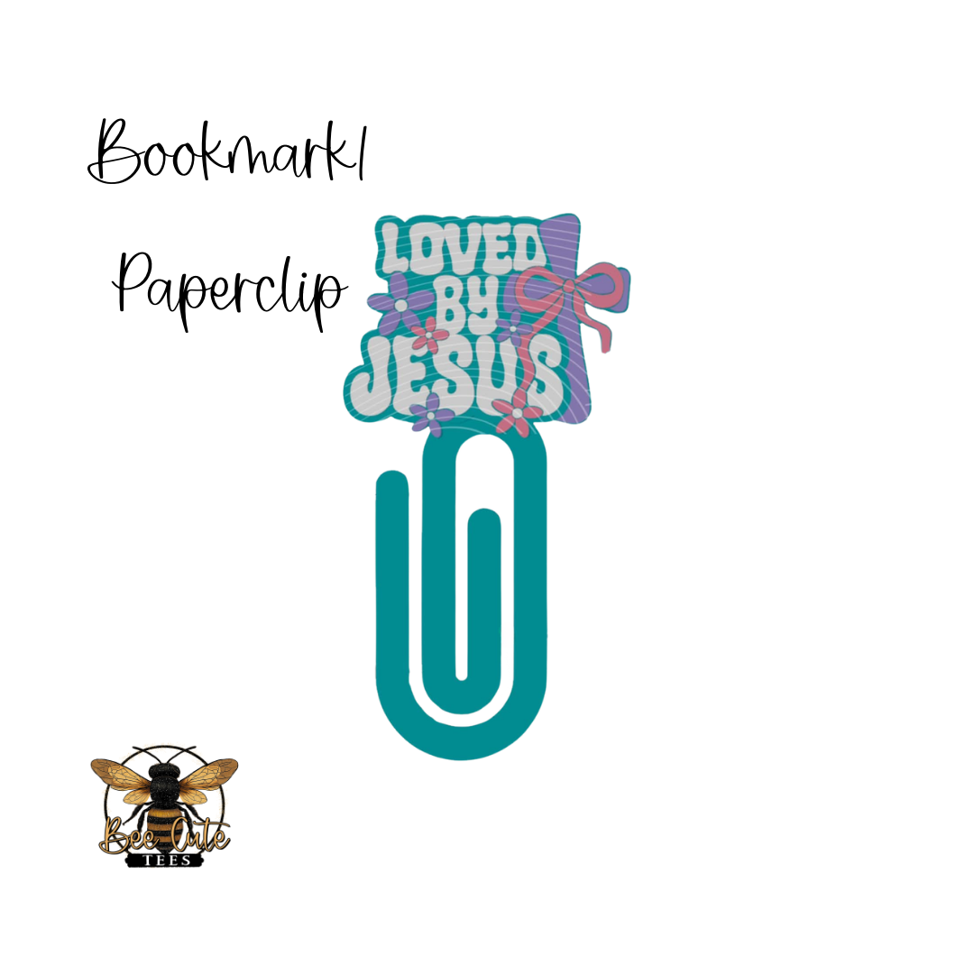 Bookmark paperclip with 'Loved by Jesus' text on a white background