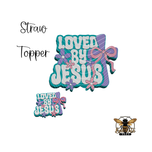 straw topper with a loved by Jesus design on a white background