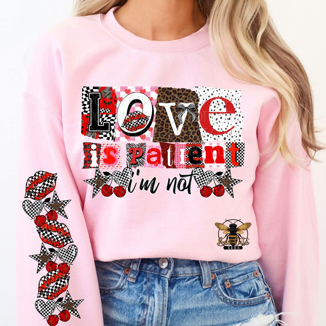 Pink sweatshirt with patterned text and graphics worn by a person
