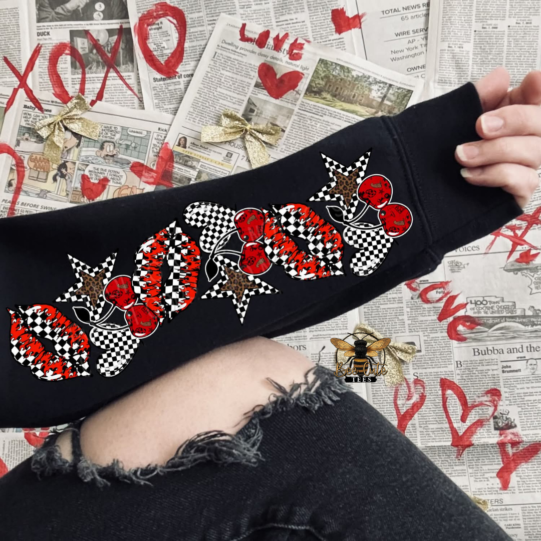 Black sweatshirt with red and white pattern on a newspaper background