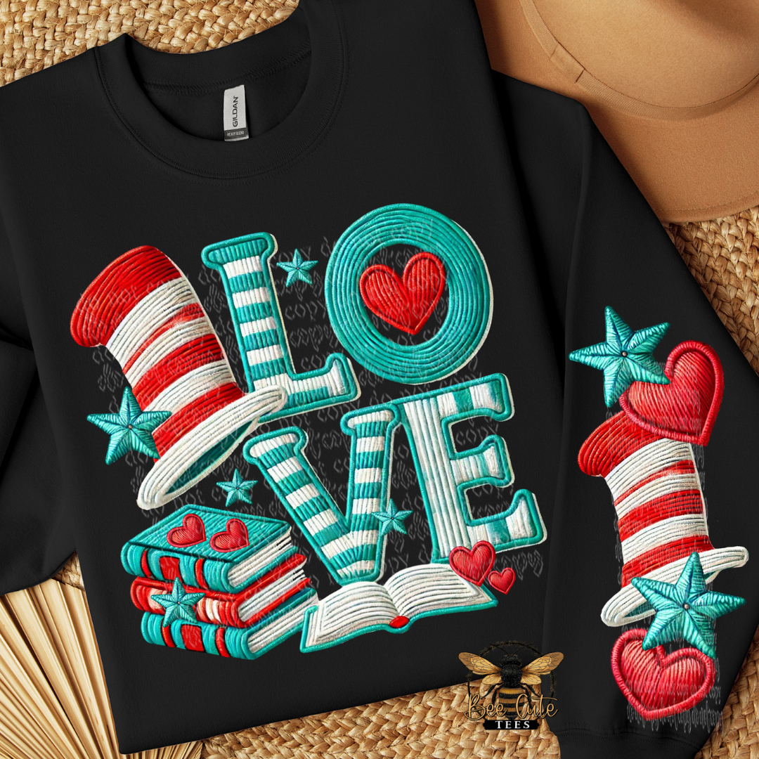 Black sweatshirt with colorful 'LOVE' design on a woven surface