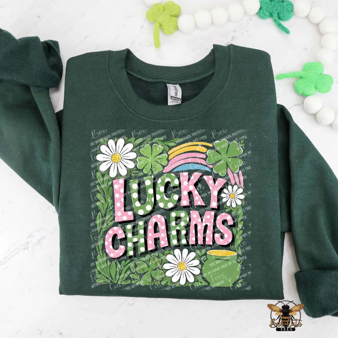 Green sweatshirt with 'Lucky Charms' design featuring flowers and a rainbow on a white background.