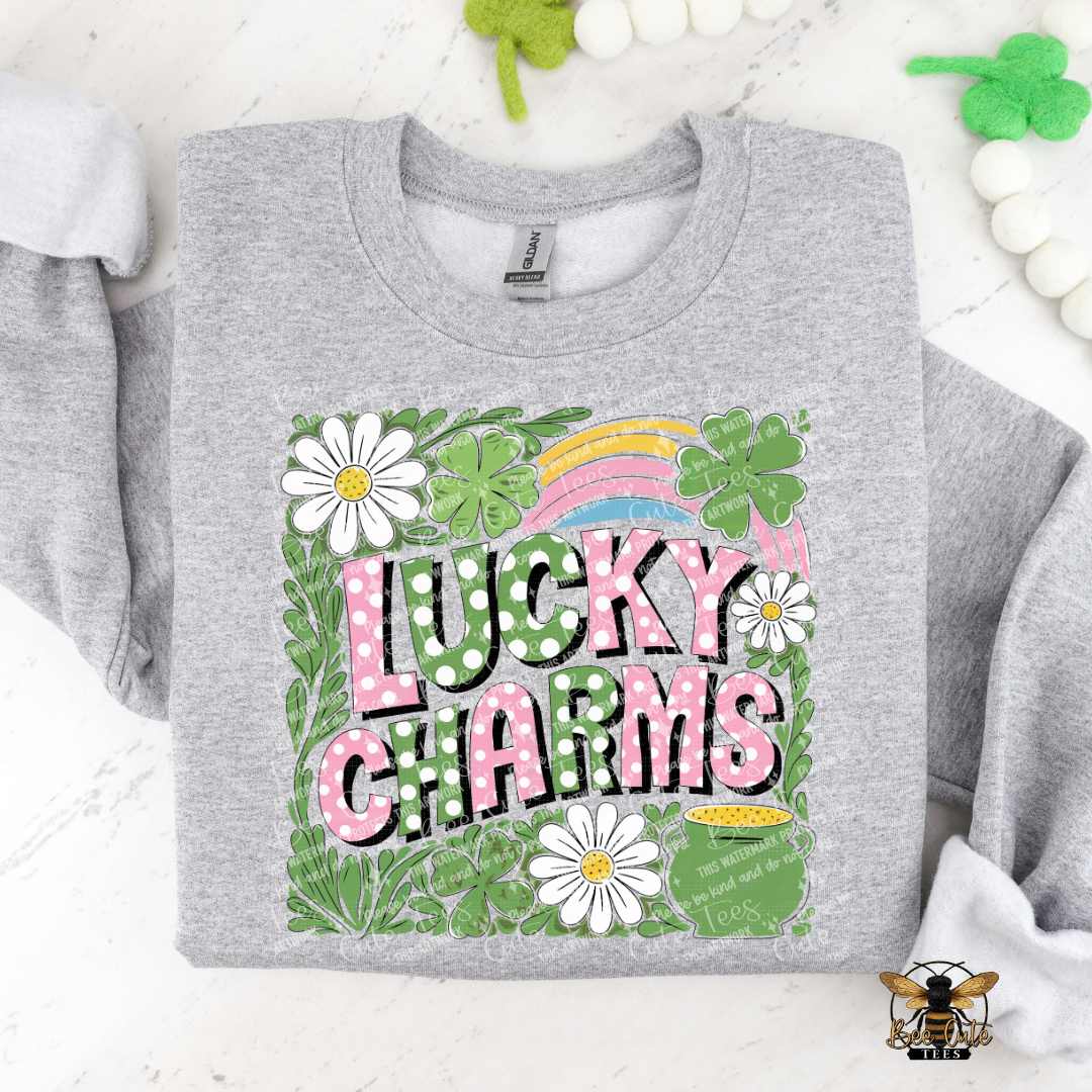 Gray sweatshirt with 'Lucky Charms' design featuring flowers and a rainbow on a white background.
