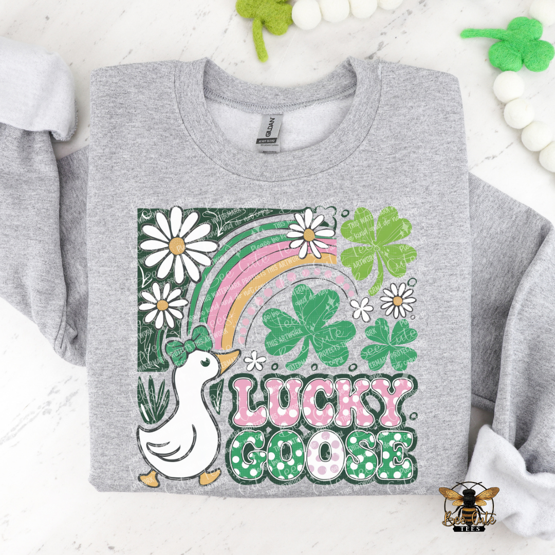 Gray sweatshirt with 'Lucky Goose' design featuring a goose, rainbow, and shamrocks on a white background.