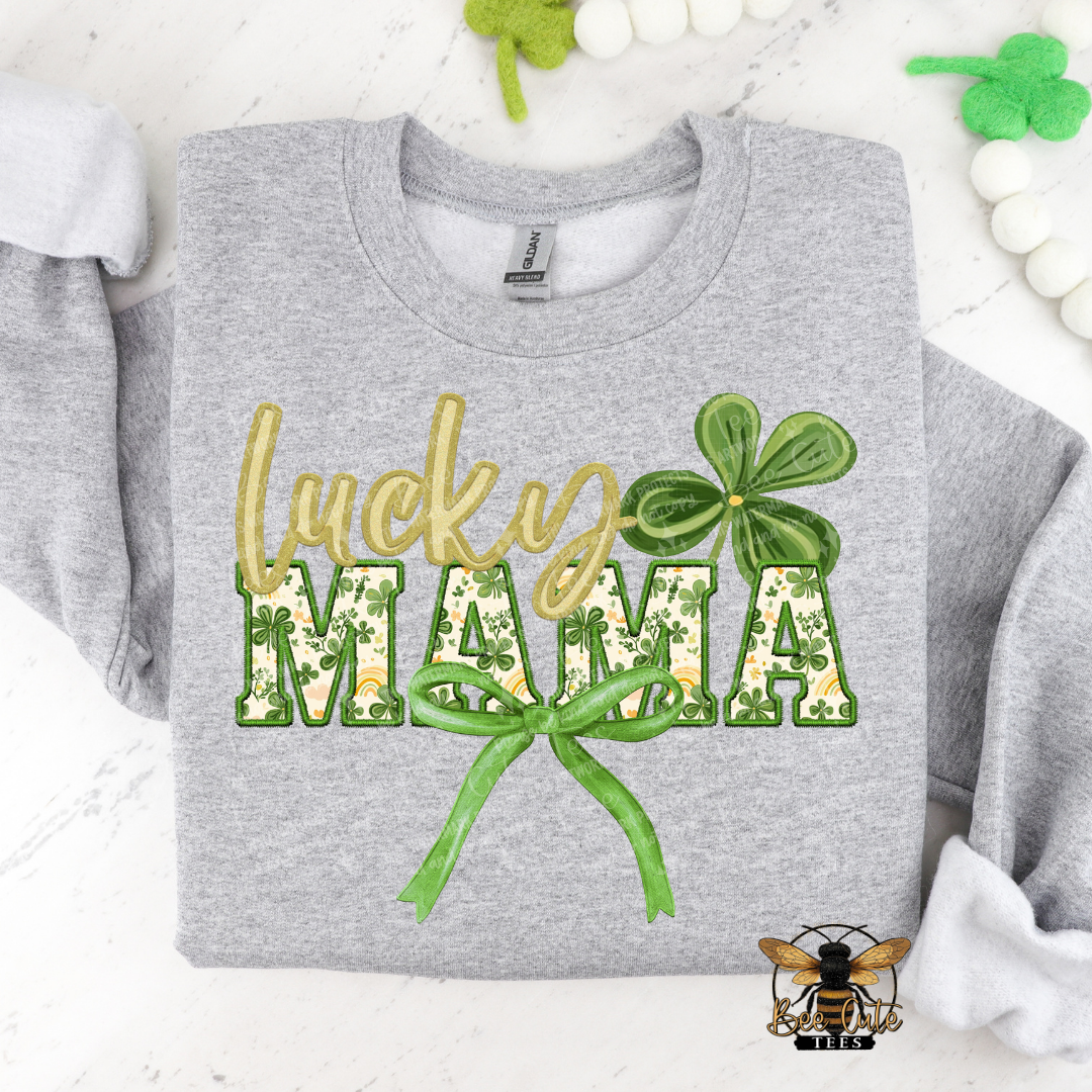 Gray sweatshirt with 'lucky MAMA' text and shamrock design on a white background