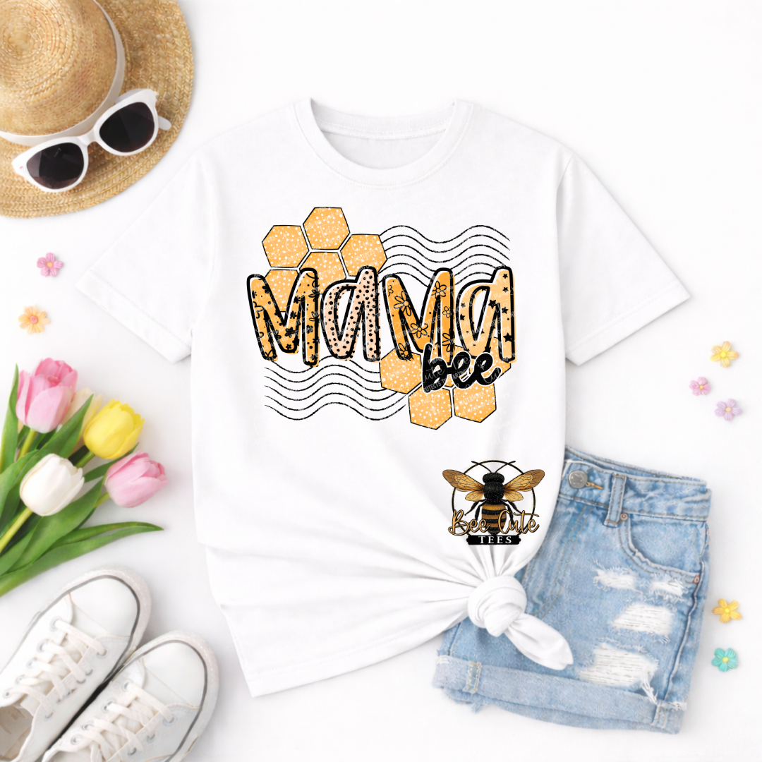 White t-shirt with 'Mama Bee' design, sunglasses, tulips, and shorts on a white background