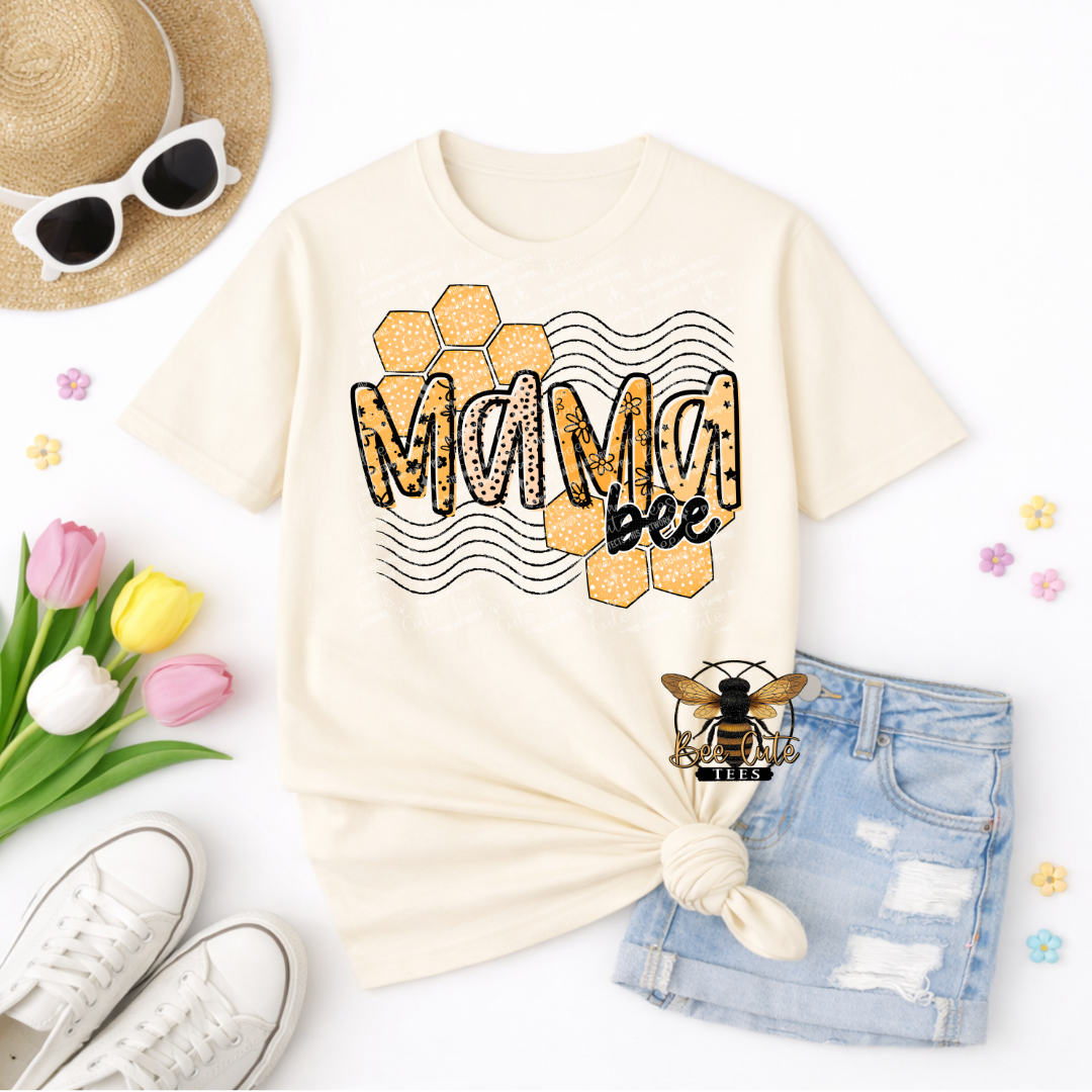 Beige t-shirt with 'Mama Bee' design, sunglasses, shorts, and flowers on a white background