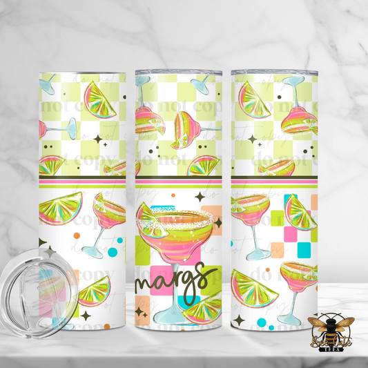 Three colorful tumblers with cocktail-themed designs on a white background