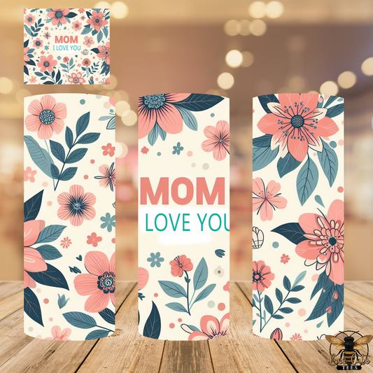Floral cards with 'Mom I love you' text on a wooden surface.