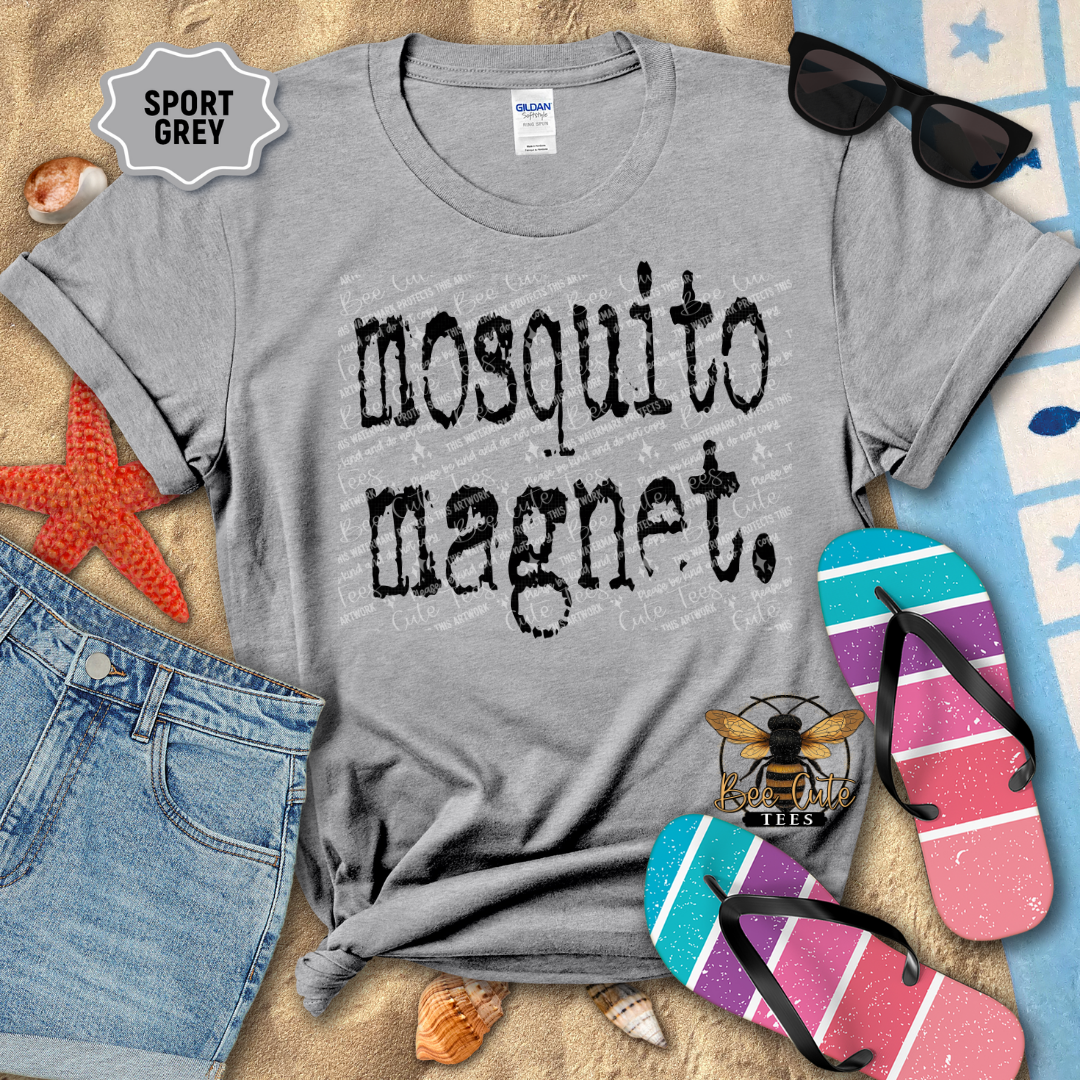 Gray t-shirt with 'mosquito magnet' text on a beach-themed background