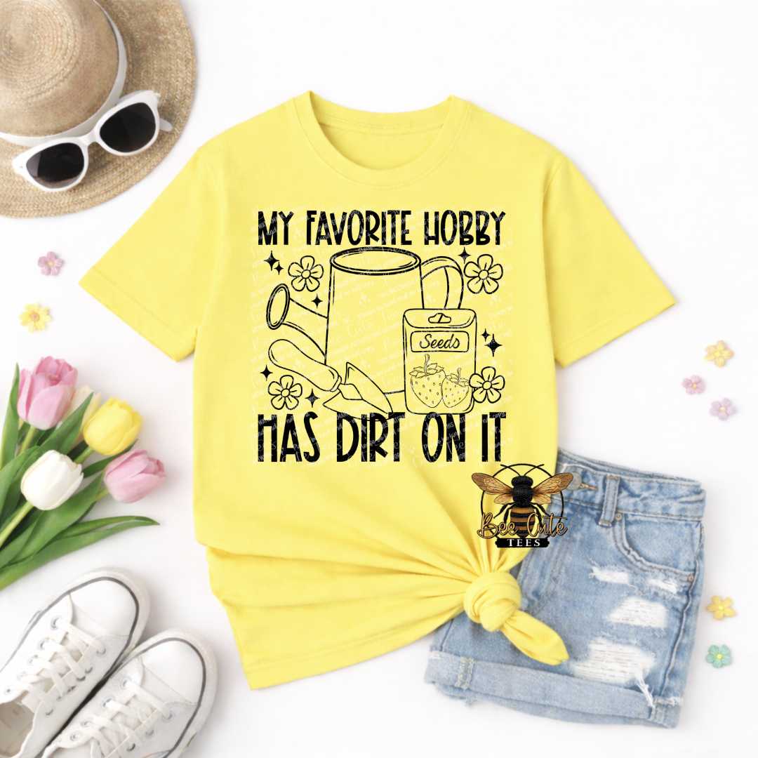 Yellow t-shirt with gardening graphic and text, sunglasses, tulips, and shorts on a white background