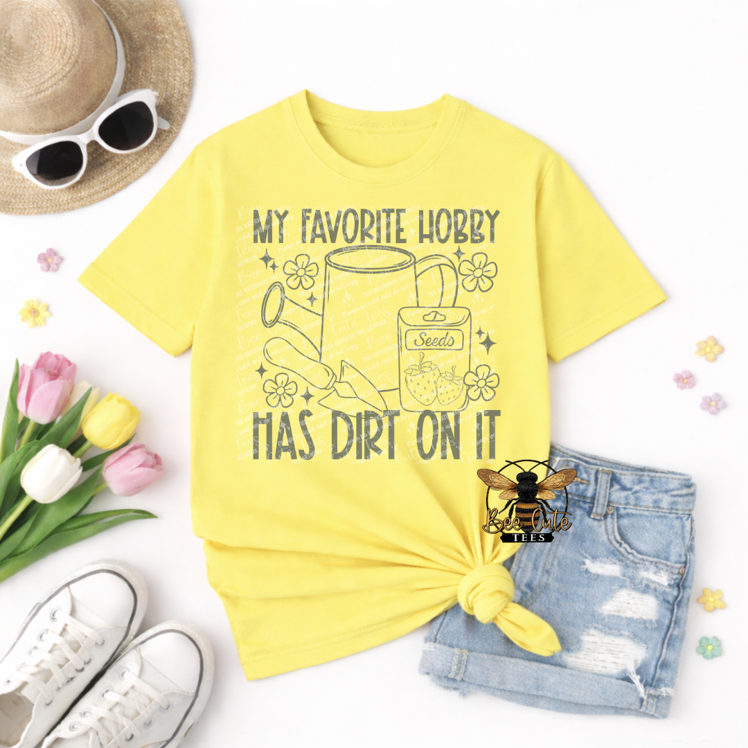Yellow t-shirt with gardening graphic and text, sunglasses, tulips, and shorts on a white background