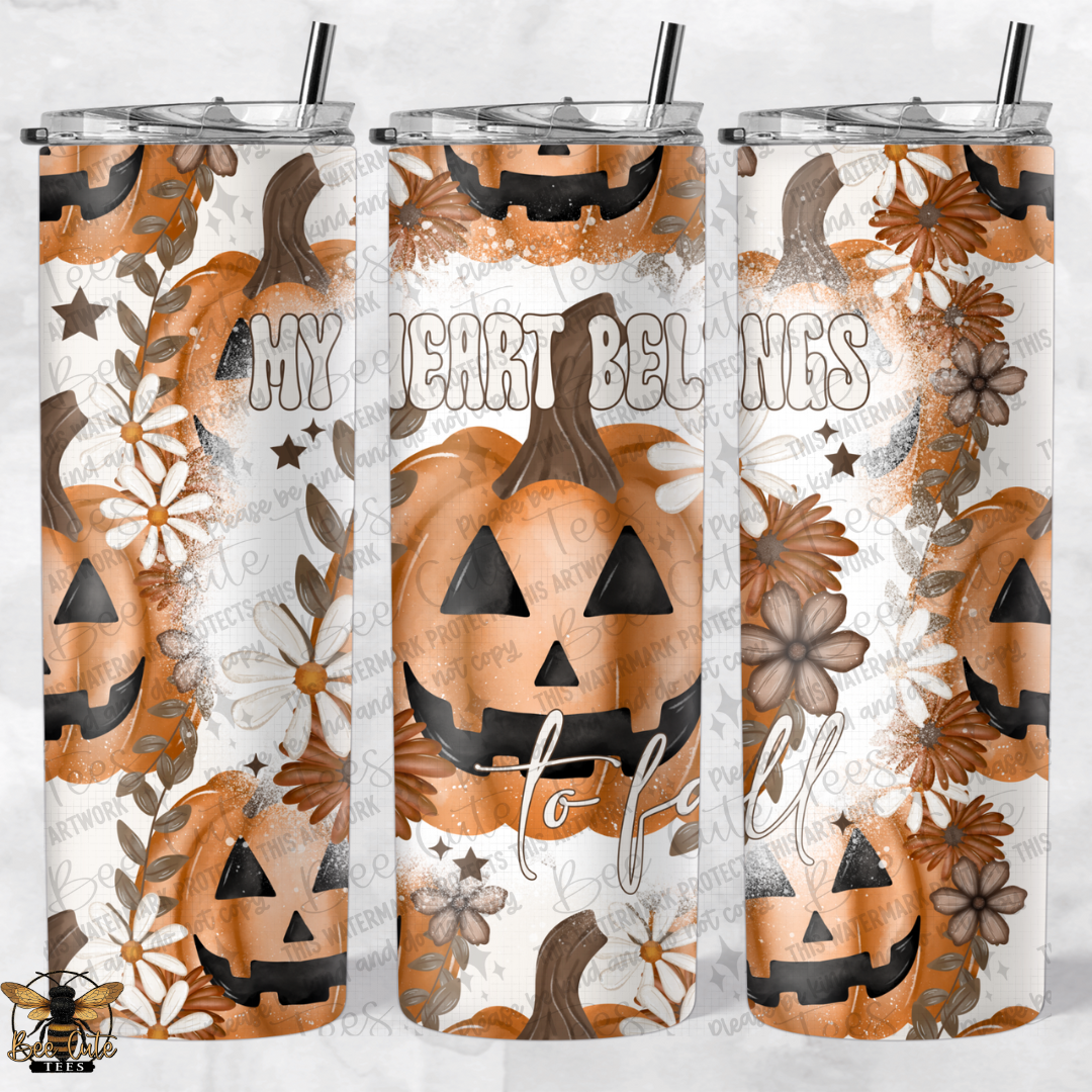 Three Halloween-themed tumblers with pumpkins and floral designs on a white background.