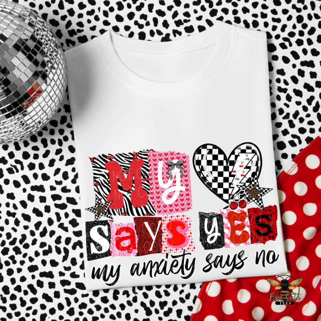 White t-shirt with colorful text design on a patterned background