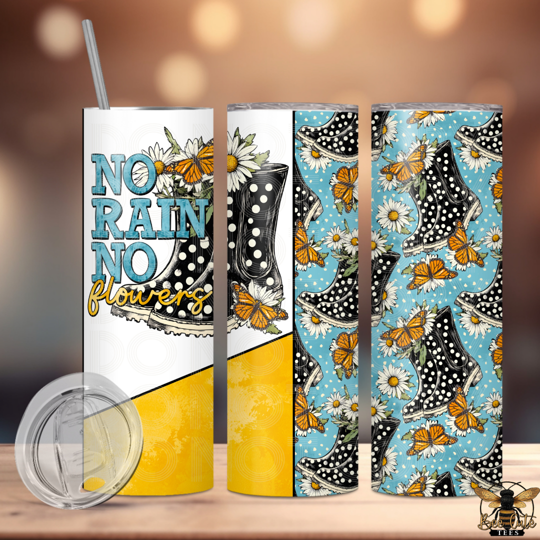 Three tumblers with butterfly and boot designs on a wooden surface.