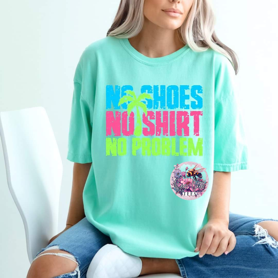A person wearing a green t-shirt with the text 'NO SHOES NO SHIRT' on the front.