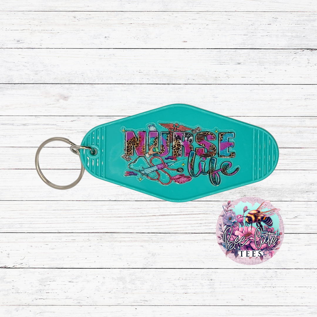Turquoise keychain with 'Nurse Life' text on a wooden surface