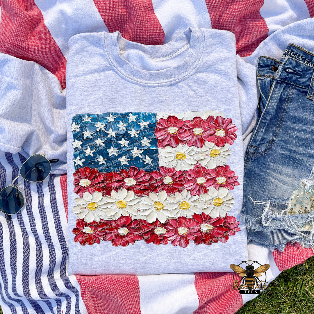 Gray sweatshirt with American flag design made of flowers on a colorful background