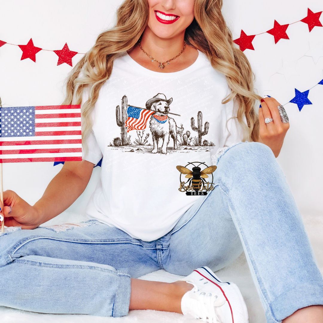 Woman wearing a white t-shirt with a graphic design, holding an American flag, and sitting on a white background with red and blue star decorations.