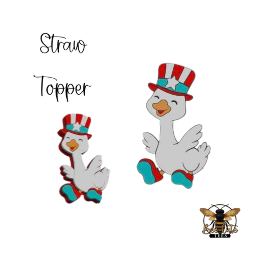 Two goose-shaped straw toppers with patriotic hats on a white background, featuring the brand logo at the bottom right corner.