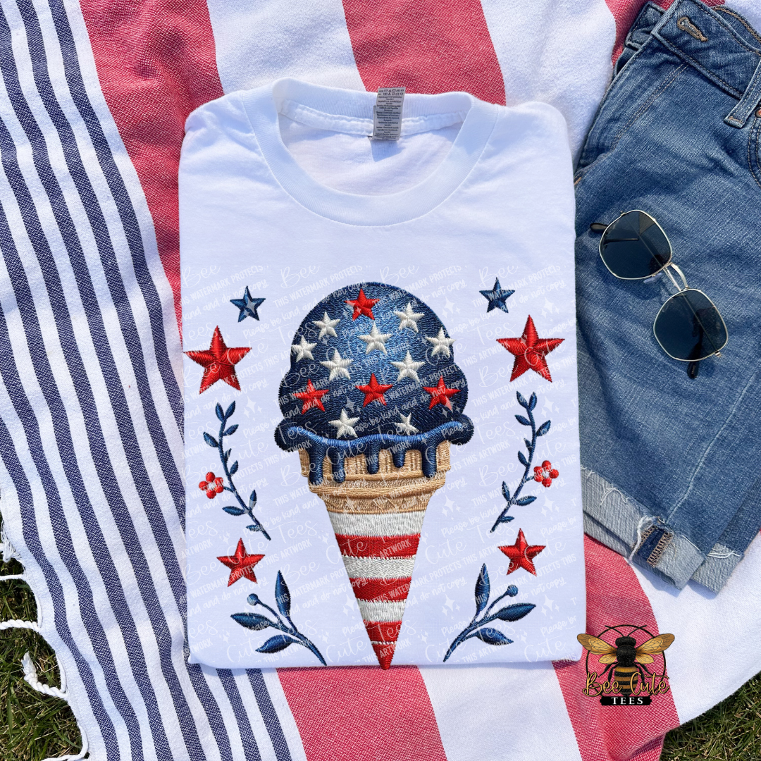 White t-shirt with ice cream cone design featuring stars and stripes on a flag background.