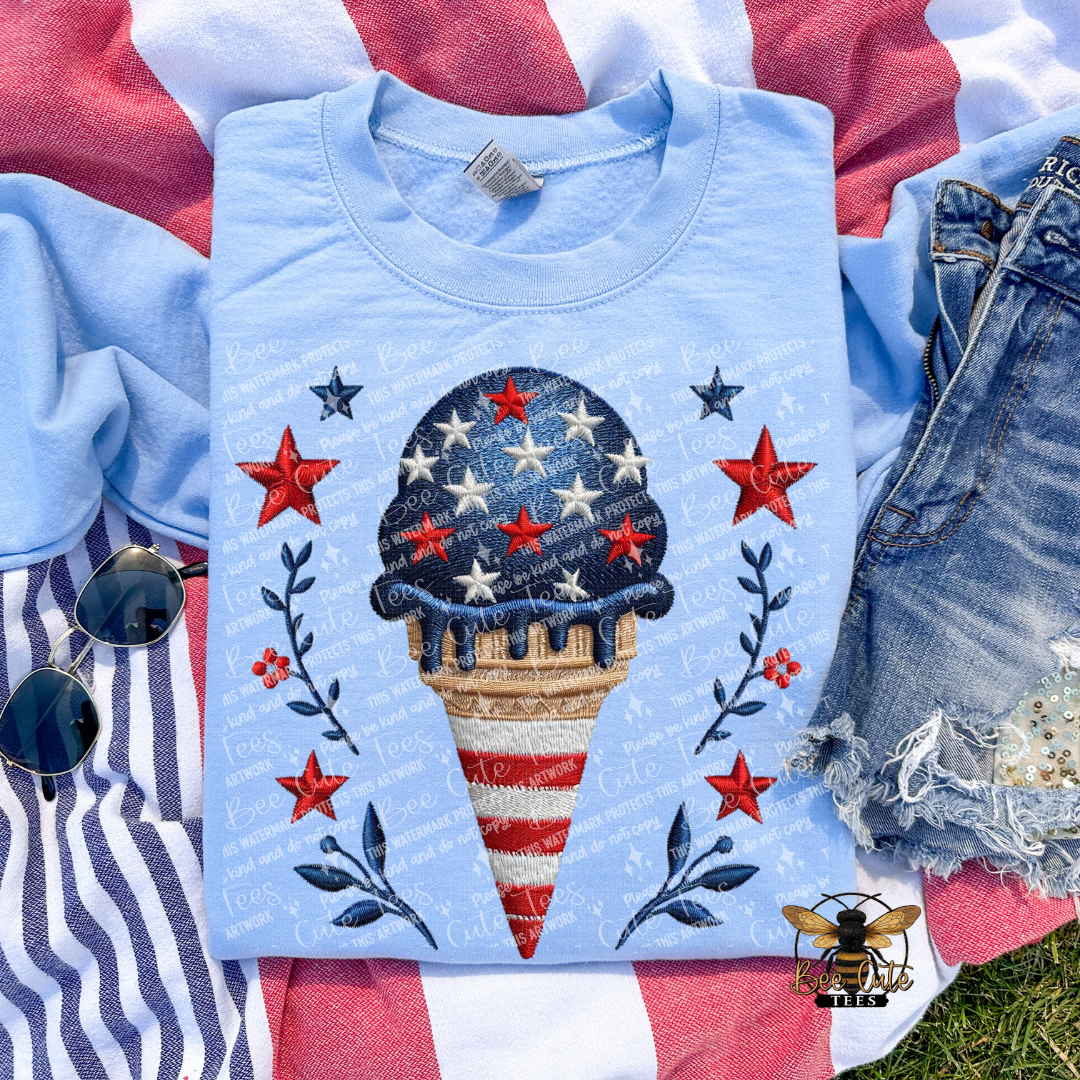 Light blue t-shirt with ice cream cone design on a red, white, and blue background
