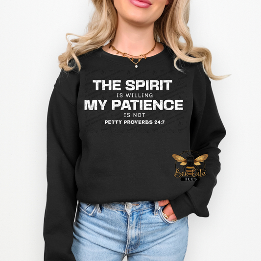 Person wearing a black sweatshirt with a motivational quote, standing against a white background.