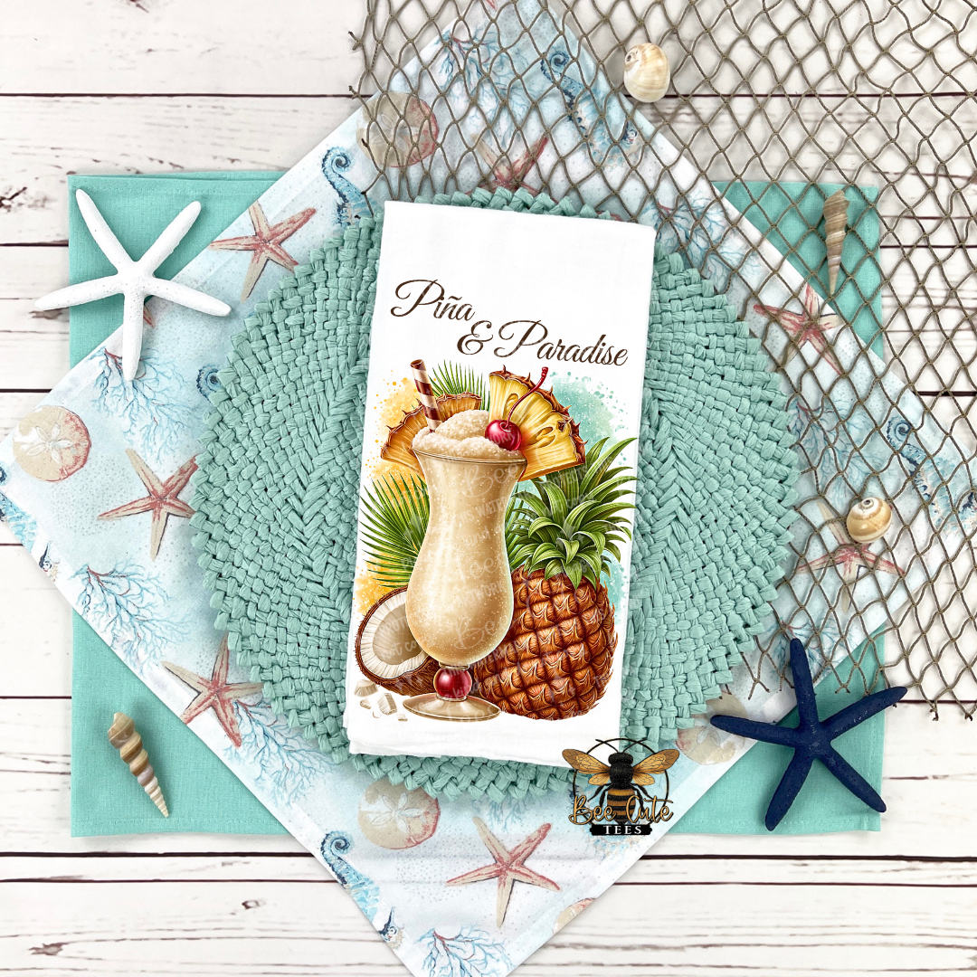 Teal placemats with pineapple and cocktail design on a wooden surface