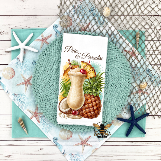 Teal placemats with pineapple and cocktail design on a wooden surface