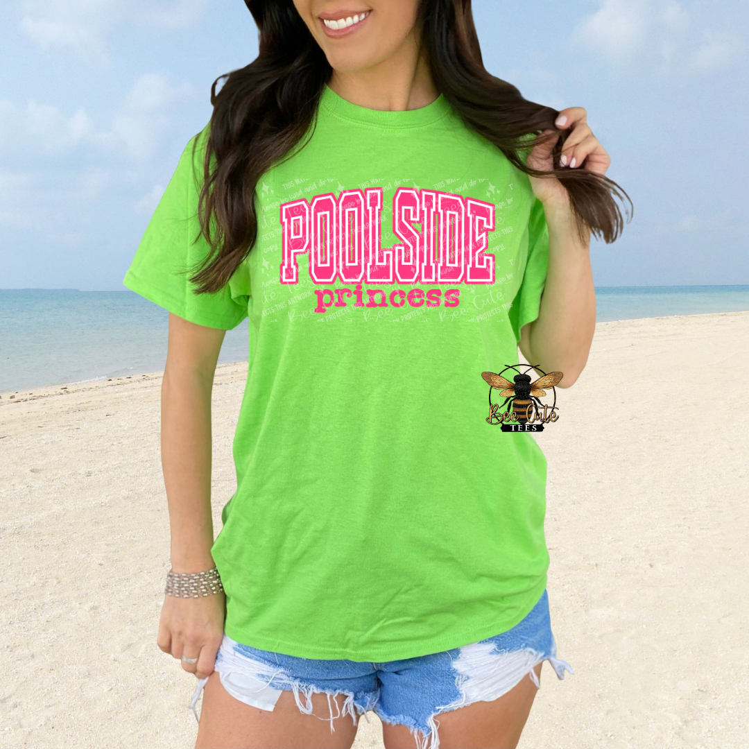 Person wearing a bright green 'Poolside Princess' t-shirt on a beach.