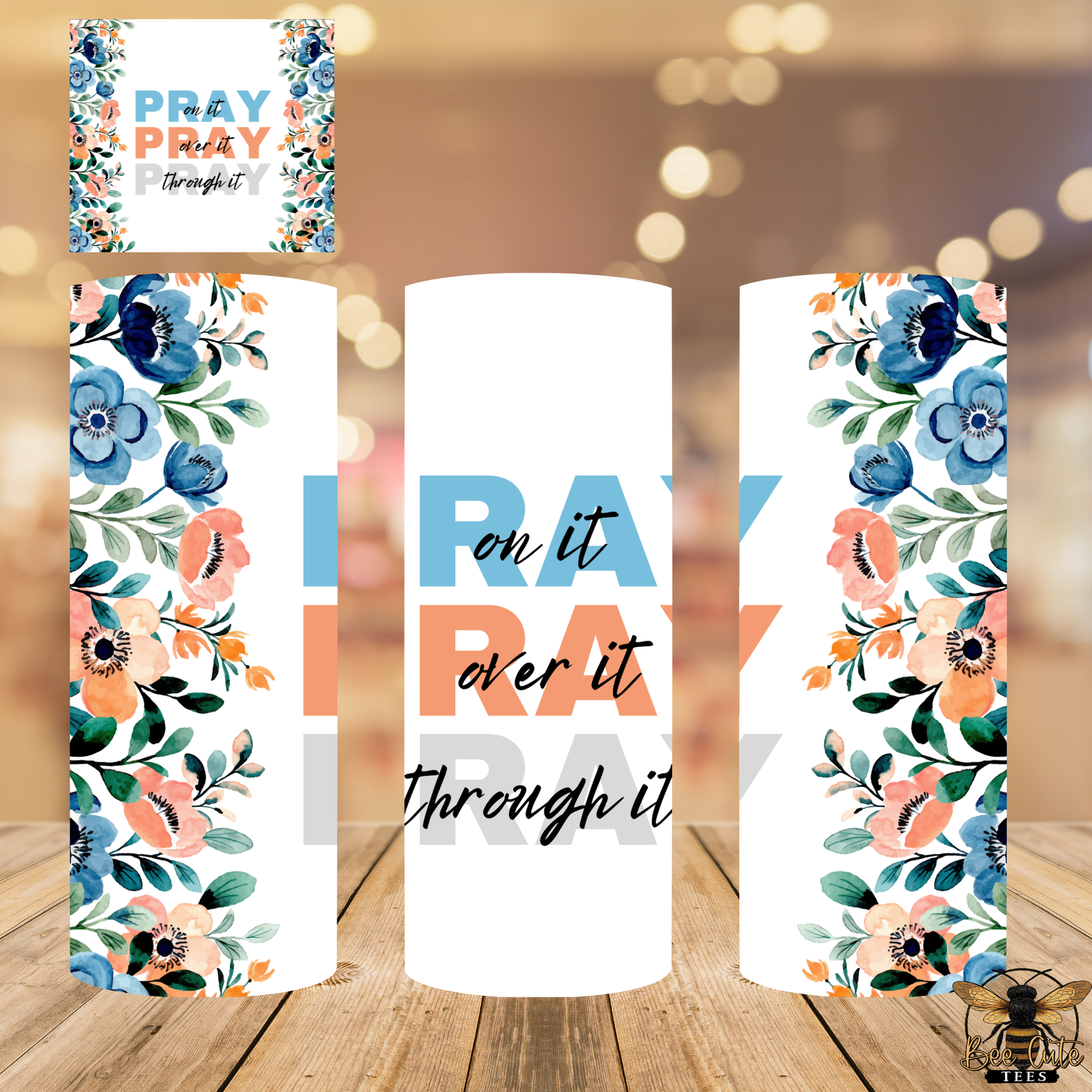Floral bookmarks with motivational text on a wooden surface