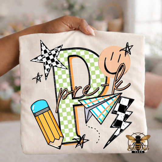 Folded white-colored unisex T-shirt held up by a hand, featuring a colorful "Pre K" graphic. The design includes green checkered number four, bold black lettering, peach script, a pencil, paper airplane, smiley face, lightning bolt, stars, and playful doodles. A fun, retro-inspired back-to-school design perfect for fourth grade teachers and students.
