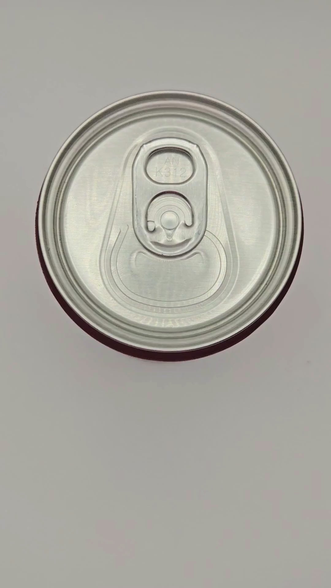 a video representation of how the nail saver can opener works using a soda can and a candy corn shaped 3d printed nail saver.