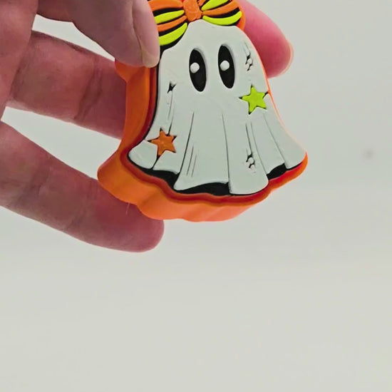 a video representation of how a fidget clicker works using a ghost design fidget clicker.