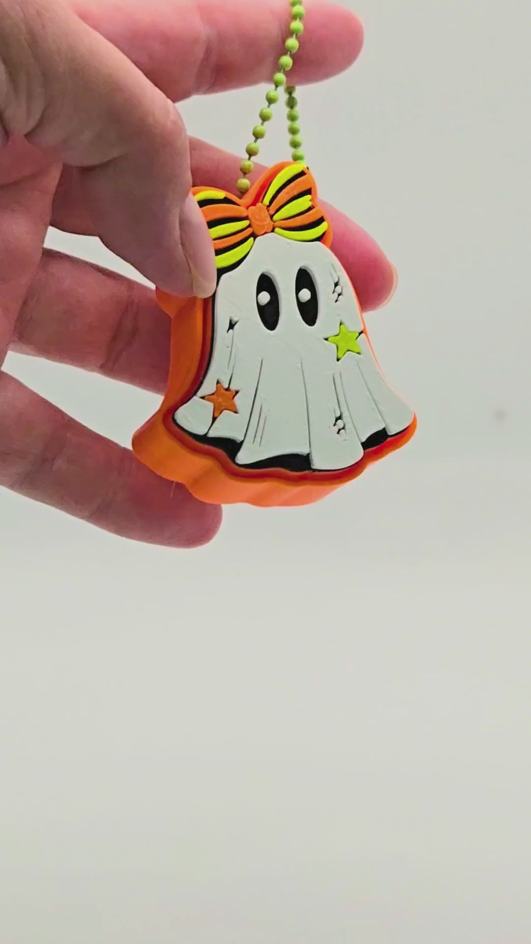 a video representation of how a fidget clicker works using a ghost design fidget clicker.