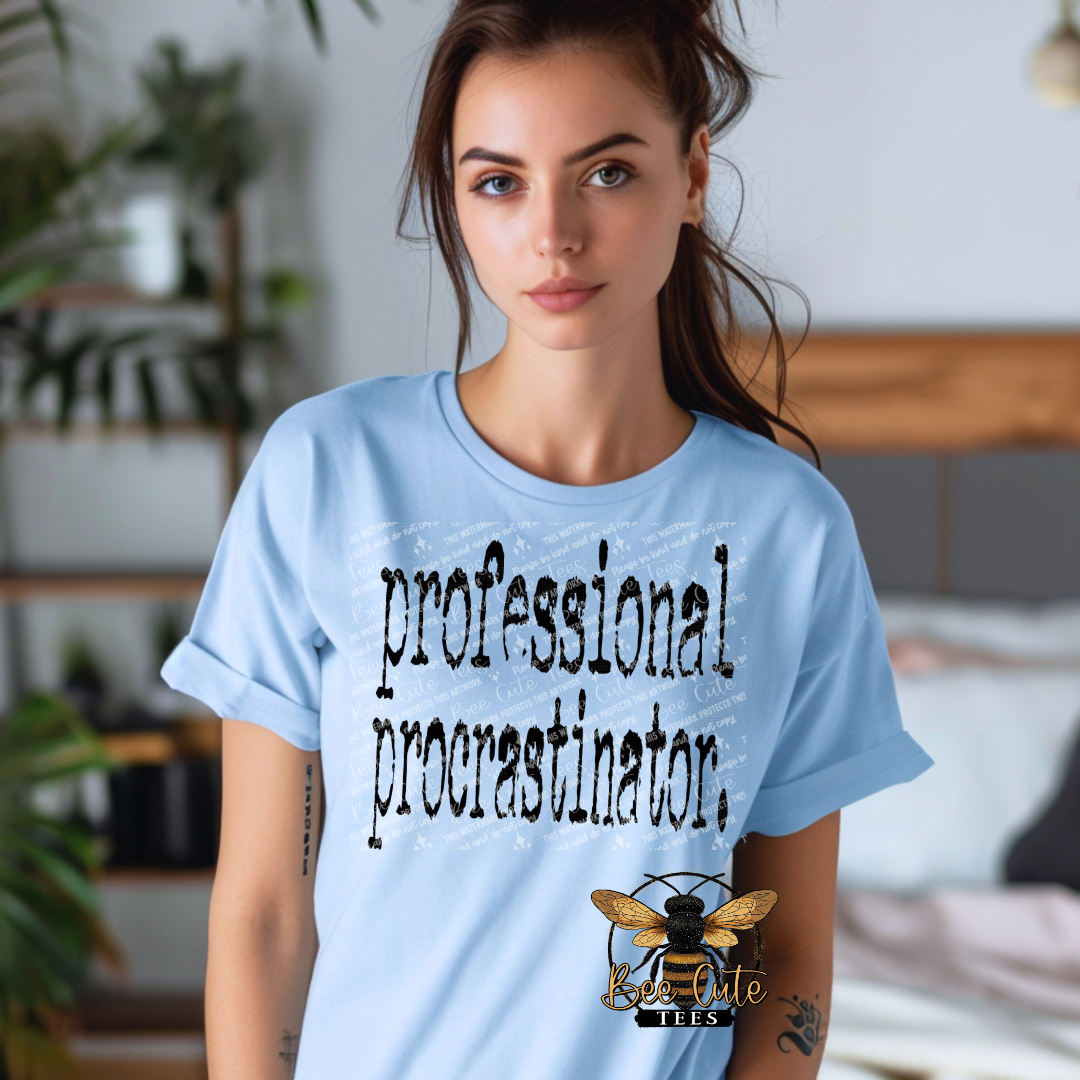 Woman wearing a light blue t-shirt with 'professional procrastinator' text and a bee logo.