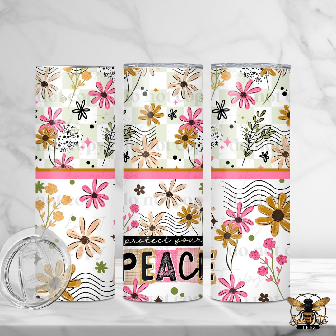 Three floral-patterned tumblers on a white background