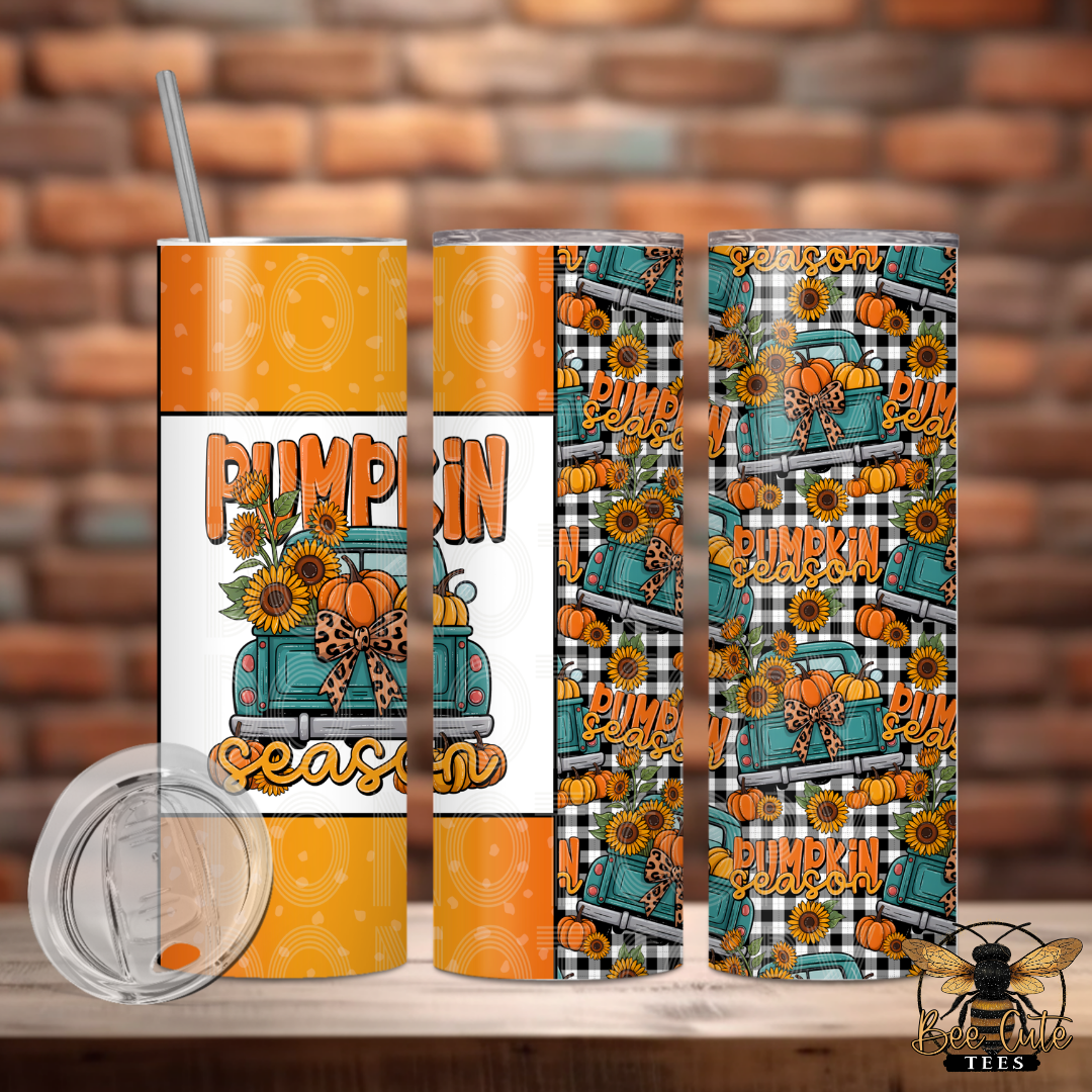 Three views of a skinny tumbler with a fall pumpkin truck wrap design, including a clear lid, shown against a brick wall background.