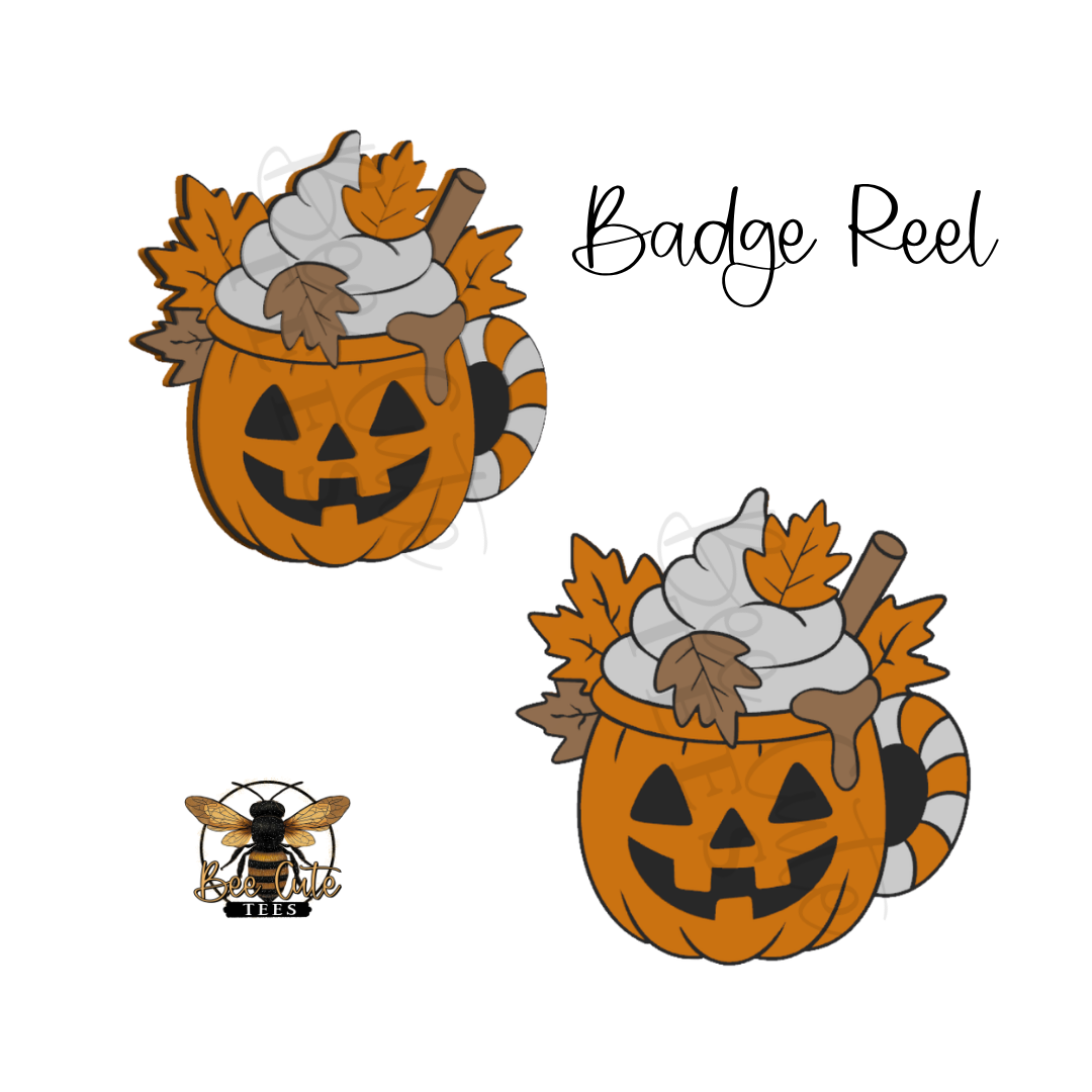 Digital preview of a Halloween-themed badge reel design featuring a jack-o'-lantern mug topped with whipped cream, autumn leaves, and a cinnamon stick, shown twice on a white background with the text 'Badge Reel' and a small bee logo.