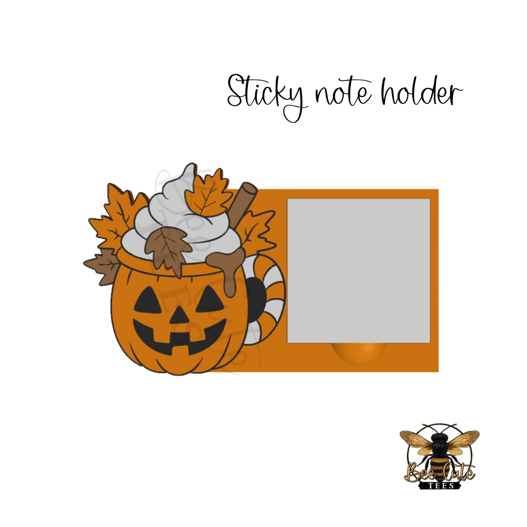 A Halloween-themed sticky note holder featuring a carved pumpkin filled with whipped cream, autumn leaves, and a cinnamon stick, next to a blank photo slot. The text 'Sticky note holder' appears above, and a bee logo with 'Bee Cute Tees' is in the bottom right corner.
