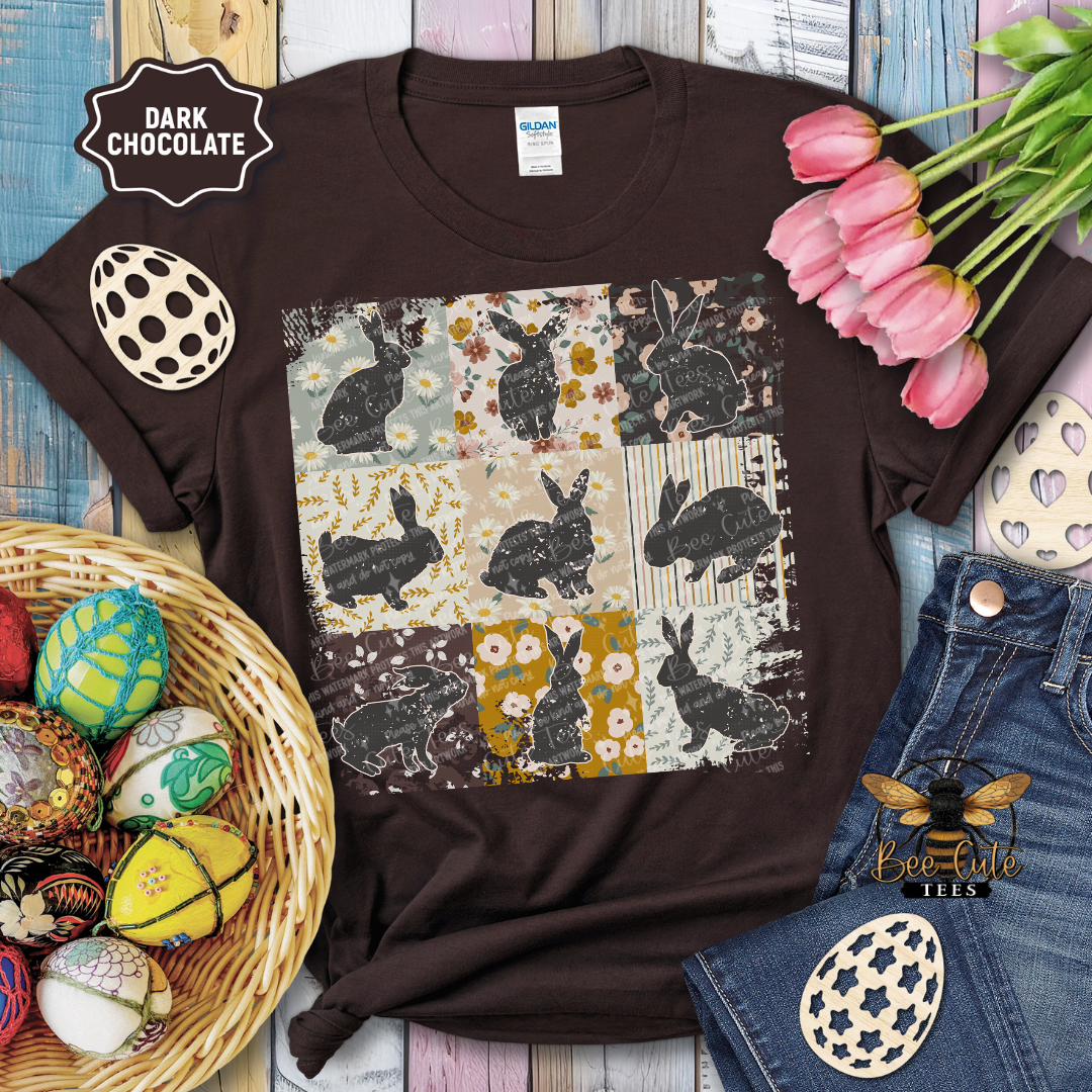 Brown t-shirt with rabbit pattern on a wooden surface with Easter decorations